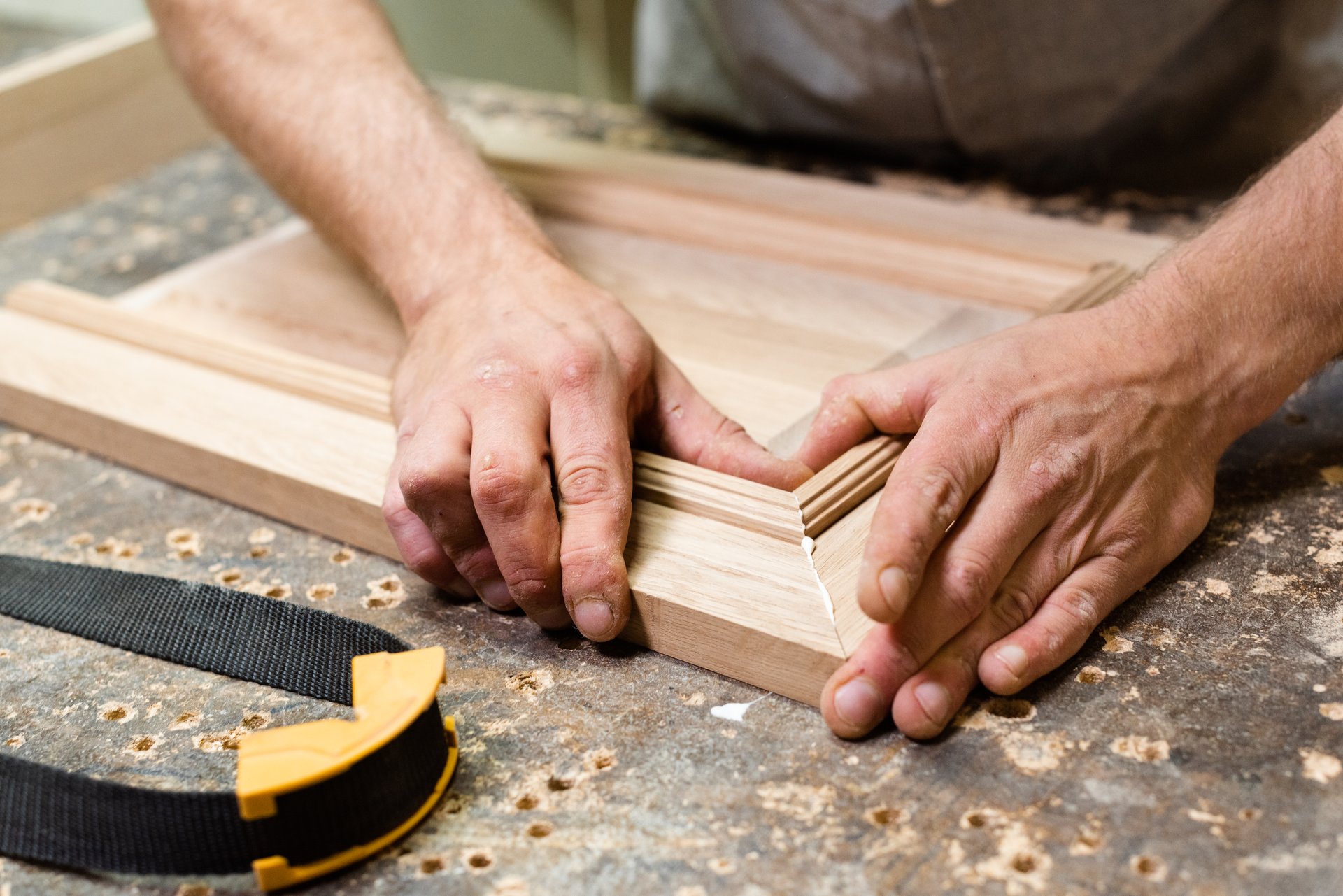 Carpenter joining cabinet parts for gluing